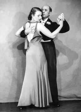 07/06/1933 Models posing to show the wrong way for a man to hold his partner dur Stock Photos