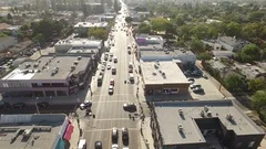Aerial drone footage over Melrose Avenue, Los Angeles tilt up