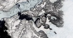 High-altitude overflight aerial of fast receding Jakobshavn Glacier, Greenland