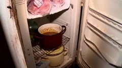 old rusty fridge homeless