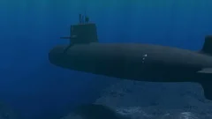 Submarine patrolling close to the ocean floor