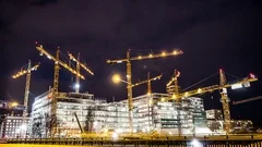 Construction site at night Time Lapse. Working tower cranes