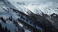 4k aerial drone footage.  Colorado Rocky Mountains in snow after Winter blizzard