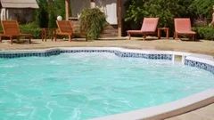 Four kids jumping into pool with long run and swimming bathing in slowmotion