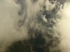 Fly through the clouds. Aerial drone smooth filming above puffy clouds.