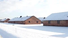 Steadicam shot of Auschwitz Birkenau barracks in winter. German Nazi