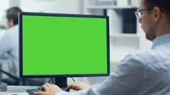 Businessman Working on a Personal Computer with Green Screen on.