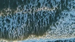 Aerial Drone Footage Of Ocean Waves Breaking On Shore