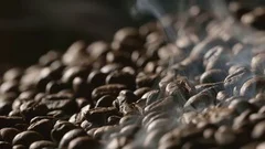 Close up of roasted coffee beans with a smoke