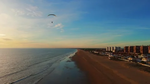 0725(1)High angle view of a paraglider soaring over scenic nature Stock Footage 340463231