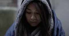 4k, Closeup shot of a young homeless woman looking at people