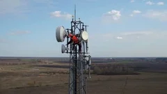 man working on radio telecommunication tower, radio master works at great