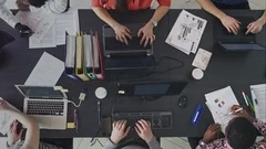 Timelapse of people working efficiently in a contemporary workplace