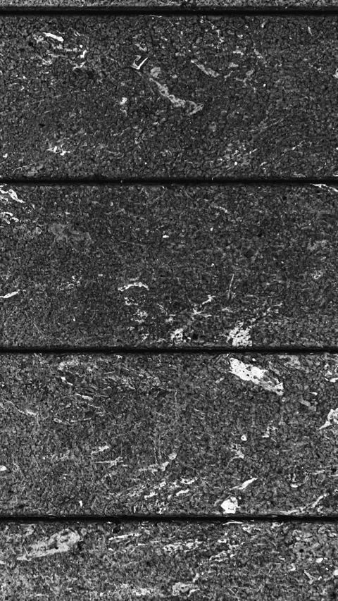 073_Rough dark stone tile pattern.mp4 Stock Footage 345817578
