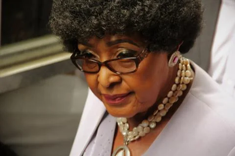 the controversial Winnie, Former wife of Nelson Mandela. Mandela divorced her when he found out she had been having an adulterous affair with a bodyguard. Winnie has never managed to clear her name, she was accused of the murder of young Stompie during Apartheids darkest days. xkwx people, portrait, person, young, vertical, adult, fashion, style, sunglasses, one, man, boy, face, beautiful, woman, smile, men, happiness, trendy, lifestyle, winnie madikizela-mandela, african icon, old struggle icon, resistance, nelson mandelas ex-wife