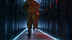 Security Alarm with Flasher Triggered in Data Center. Two Military Men Running 