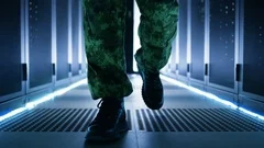 Follow up Shot of Soldier's Legs. He's Walking in Ultra Modern Data Centre