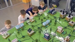 Elementary school students doing study alternative energy project on a city
