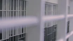 Prison cells through bars slider