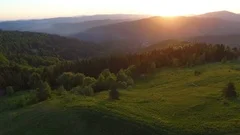 Beautiful aerial view of forest in mountains on sunset
