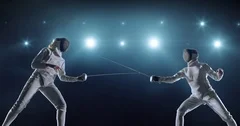 Two female fencing athletes in action