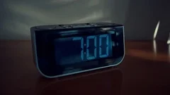 close up shot of alarm clock turns 7 AM