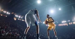 Basketball: Two opposing basketball players facing each other