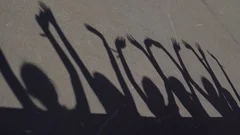 Children shadows waving