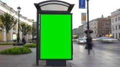 Time Lapse. A Billboard with a Green Screen on a Busy Street