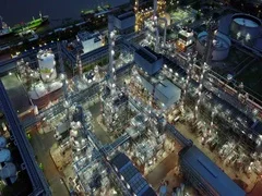 4K Night aerial shot of off oil refinery