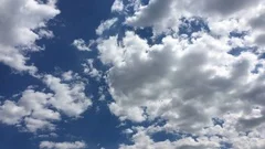 White clouds disappear in the hot sun on blue sky.Time-lapse motion clouds blue 