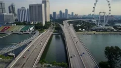 Aerial view of highway and giant ferris wheel 'The Flyer' in Singapore