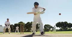 Batsman playing a defensive stroke during cricket match