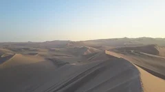 Aerial view of Sand Dunes in a Sunny Desert. Oasis.