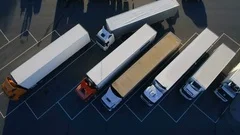 Aerial Top View of White Semi Truck with Cargo Trailer Parking with Other Trucks
