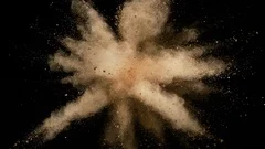 Colorful powder/particles fly after being exploded. Slow Motion.