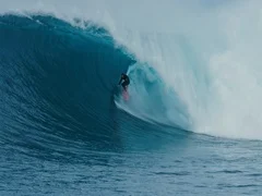 Surfer rides giant blue ocean wave. Shot on RED in 4k. Big wave surfing. Slow mo
