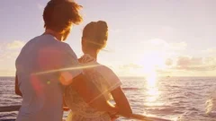 Cruise ship yacht vacation couple enjoying sunset sailing on small cruise boat