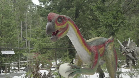 08 Dec 2024, Bukovel, Ukraine. Moving artificial dinosaur sculpture Stock Footage 294880227