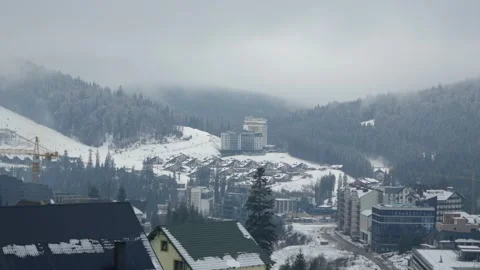 08 Dec 2024. Clouds float on the mountain resort town of Bukovel, Ukraine Stock-Footage 294943581
