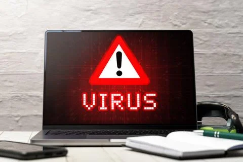  08 July 2023: Warning of a computer virus on a laptop in an office PHOTOM... Stock-Fotos
