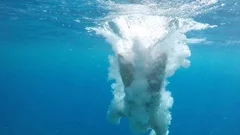 Man diving into water slow motion view