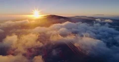 Aerial: flying above the clouds at sunset in Silicon Valley, California, USA