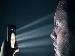 Male using latest smartphone technology for a biometric facial recognition