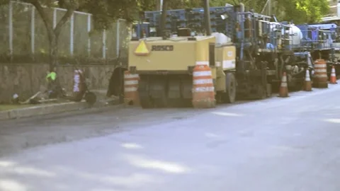 On 08/07/2023, skilled workers and machinery transform roads in San Salvado.. Stock-Footage 247876844