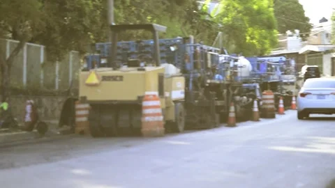 On 08/07/2023, skilled workers and machinery transform roads in San Salvado.. Stock-Footage 247876873