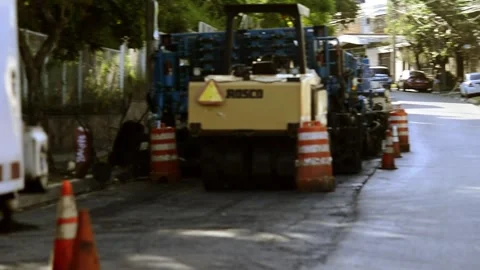 On 08/07/2023, skilled workers and machinery transform roads in San Salvado.. 스톡 동영상 247876978