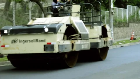 On 08/07/2023, skilled workers and machinery transform roads in San Salvado.. 動画素材 247877033