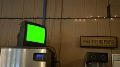A green screen standard definition TV in a diner for generic use