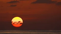 Enormous Orange Sun Setting over Phuket Tropical Beach in Timelapse